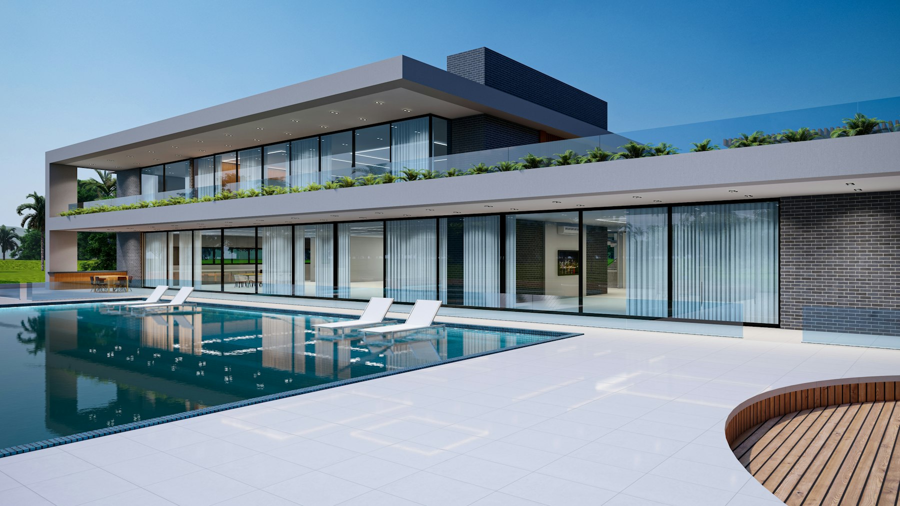 Piscine rectangulaire devant villa contemporaine, terrasse bois